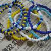 Combinations of blue, yellow and white glass beads with ocean theme charms $30 each