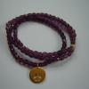 Purple crstal triple wrap with gold vermeil peace sign cutout charm  $120
(3 available)